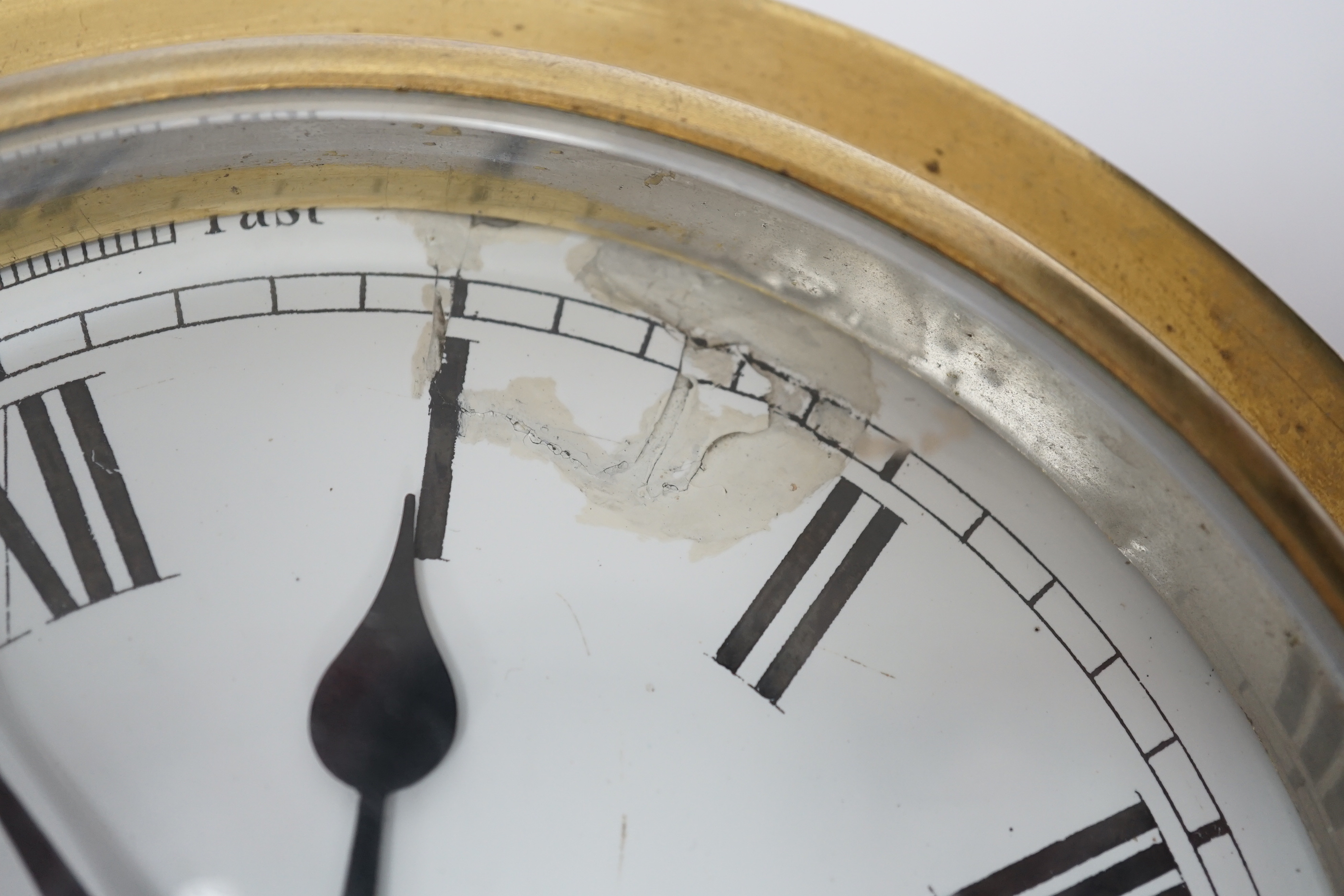 A brass ship’s bulkhead timepiece, 21cm diameter